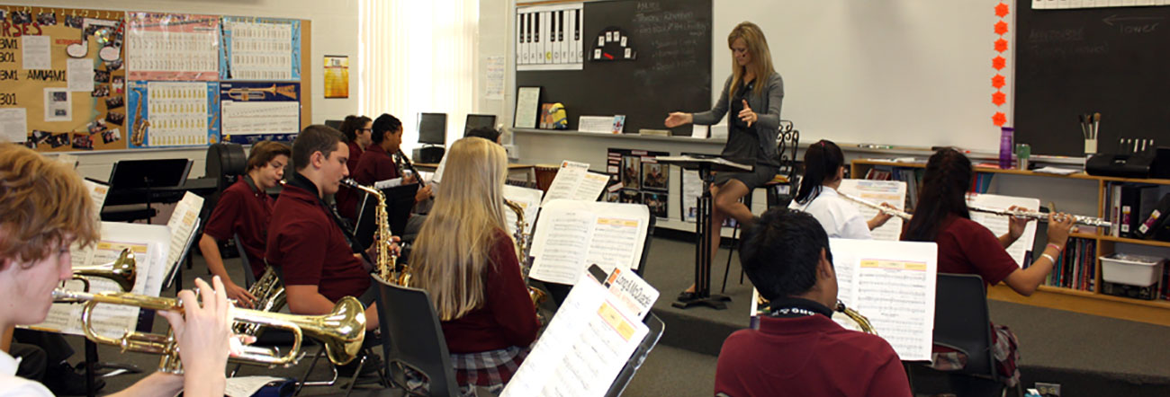 Students playing instruments in classroom